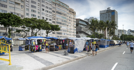 Rio de Janeiro, Brasil - March 04,2019: Clothing market on Avenida Atlantica. Citizens walkのeditorial素材
