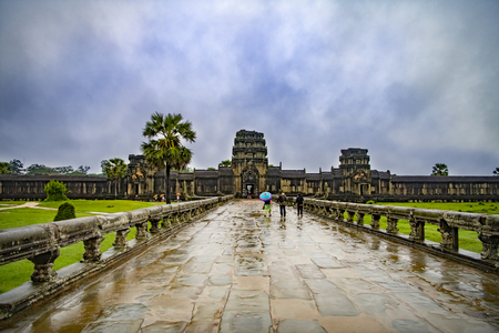 Angkor Wat,Cambodia-September 04, 2019: Angkor Wat-largest temple in the world. It is raining. Tourists walk around the templeのeditorial素材