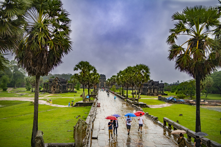  Angkor Wat,Cambodia-September 04, 2019: Angkor Wat-largest temple in the world. It is raining. Tourists walk around the templeのeditorial素材