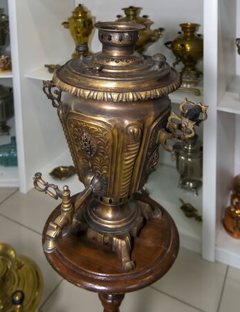 Kamensk-Shakhtinsky, Russia-August 17, 2019: Samovar - hot-water, for making tea, a copper vessel, with a pipe and a roasting pan inside- in the Museum of the Legend of the USSRのeditorial素材