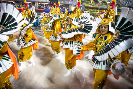 Rio de Janeiro, Brasil-  February 29, 2020: Samba Parade at the 2020 Carnival, Champions Parade, Sambodromo. It's rainingのeditorial素材