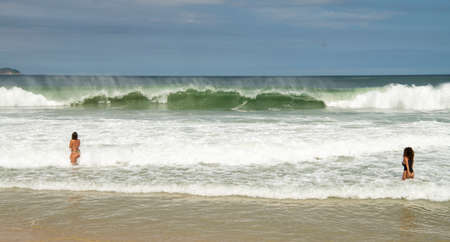 Rio de Janeiro, Brasil-  February 28, 2020: Citizens swim and sunbathe on the beach of Copacabanaのeditorial素材
