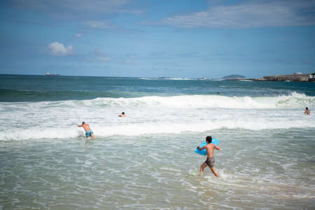 Rio de Janeiro, Brasil-  February 28, 2020: Citizens swim on the beach of Copacabanaのeditorial素材