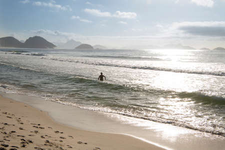 Rio de Janeiro, Brasil- March 05, 2020: Citizens swim on the beach of Copacabanaのeditorial素材