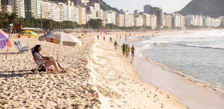 Rio de Janeiro, Brasil- March 05, 2020: Citizens swim and sunbathe on the beach of Copacabanaのeditorial素材
