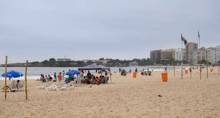 Rio de Janeiro, Brasil-  February 28, 2020: Citizens swim and sunbathe on the beach of Copacabana