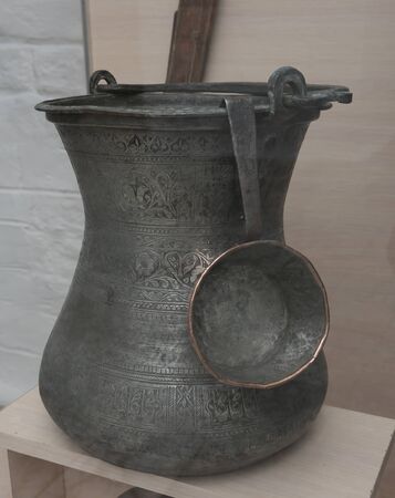 Jug with a scoop for water from copper. 19 centuryの写真素材