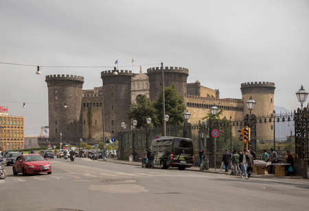 NAPLES,ITALY-APRIL 03-Transport moves around  Castel Nuovo (Anjou dungeon). Vendors selling souvenirs  on April 03,2014 in Naplesのeditorial素材