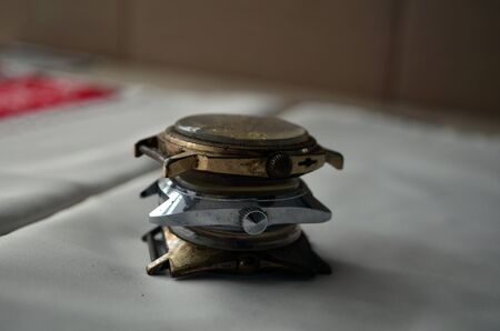 Three clocks lie on top of each otherの写真素材