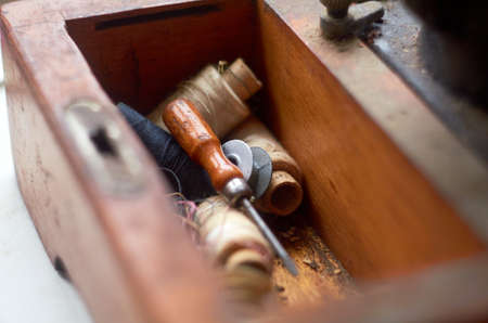Wooden compartment for storing threads, needles and toolsの写真素材
