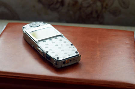 Photo of disassembled old cell phoneの写真素材