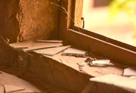 Pieces of broken glass on the windowsillの写真素材
