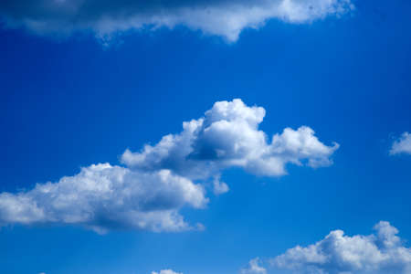 Small clouds in the blue sky in the afternoonの写真素材