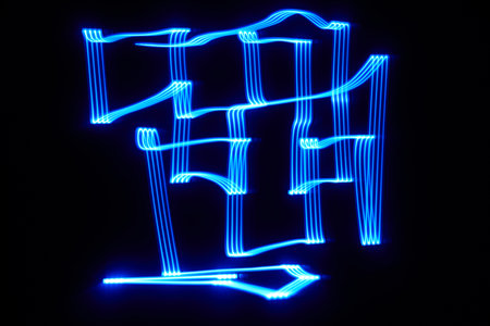 Blue light maze in the darkの写真素材
