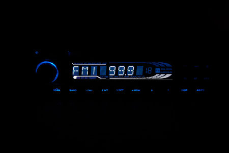 Blue and white light of car radio panelの写真素材