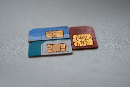 Three sim cards on a white background