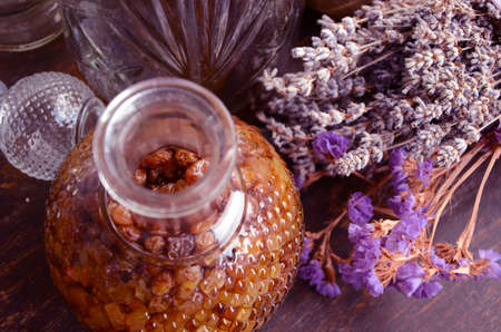 Bottle of raisins liqueur and lavender flowers