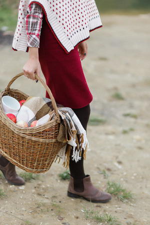 A romantic photoshoot with cups of tea and a basketの写真素材
