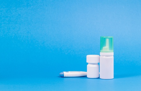 Clean medical cans on blue background.の写真素材