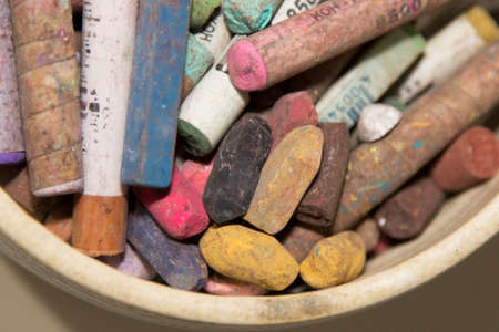 Pastel chalks in bowl, closeupの写真素材