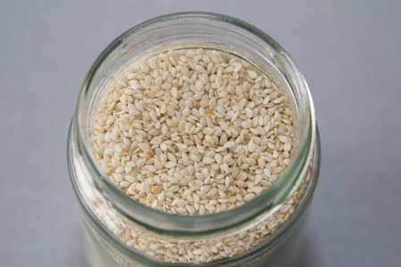 Glass jar full of sesame, top viewの写真素材