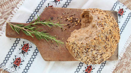 Bread with seeds on the table, top viewの写真素材