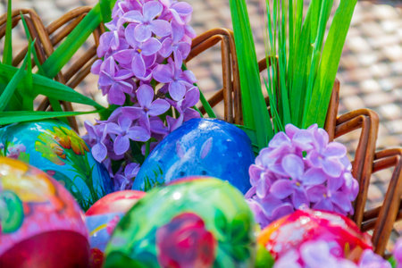 Wonderful purple hyacinth decorating striped basket full with Easter eggs