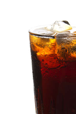 Glass of cola with ice isolated on whiteの写真素材