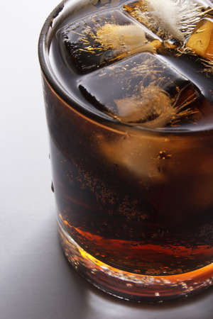 Fresh and cold cola drink in glass