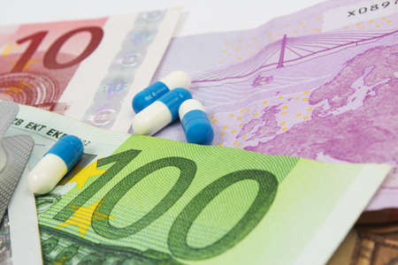 Medical pills and european currencyの写真素材