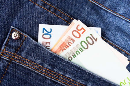 euro bills in jeans pocketの写真素材