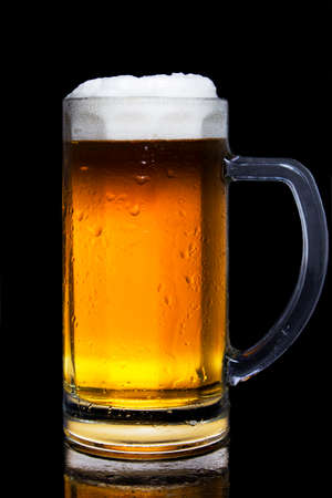 Beer glass isolated on black backgroundの写真素材