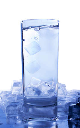 Glass of water with ice cubes on white backgroundの写真素材