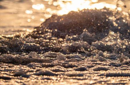 wave splash sea beach close up macro sunriseの写真素材
