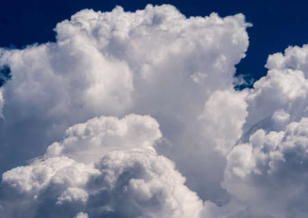 White fluffy big clouds against sky landscapeの写真素材