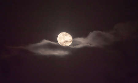 full moon in the sky with clouds landscapeの写真素材