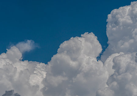 White fluffy big clouds against sky landscapeの写真素材