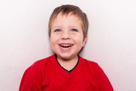 the Beautiful boy smiling, laughing joyの写真素材