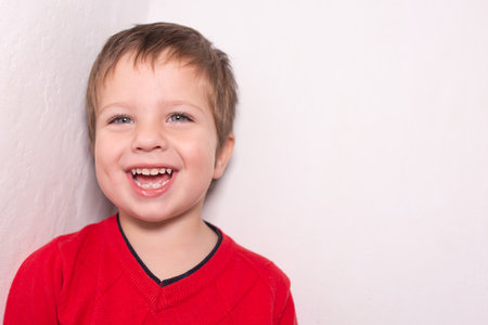 the Beautiful boy smiling, laughing joyの写真素材