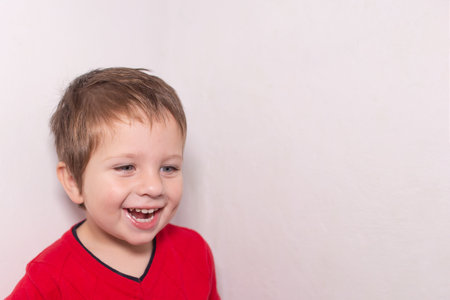 the Beautiful boy smiling, laughing joyの写真素材