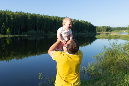 the Happy baby in daddy's armsの写真素材