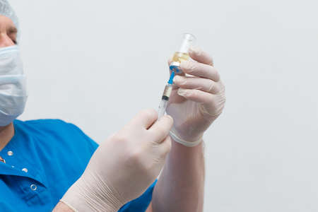 Medical brother with syringe and vaccineの写真素材