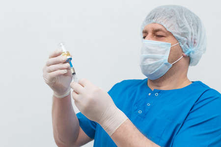 Medical brother with syringe and vaccineの写真素材
