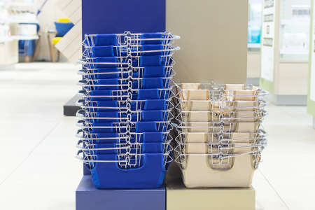 Stack of baskets for the shopper in the storeの写真素材