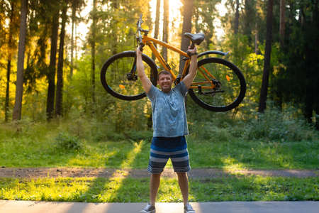 the Strong man on a bike in the park