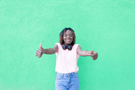 the Happy and beautiful African American shows up at you