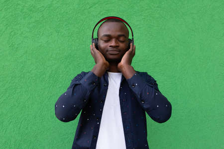 the Happy African American with headphonesの写真素材