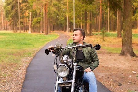 the Beautiful young man on a motorcycle