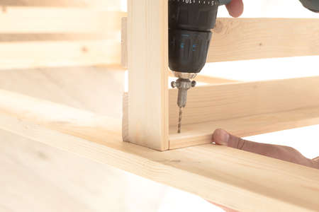 Wooden slats and working tools. Carpentry work. Working with power tools.