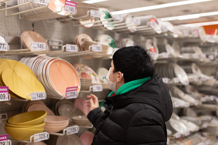 Russia, Ivanovo, November 29, 2020, editorial, The girl in the store chooses thingsのeditorial素材